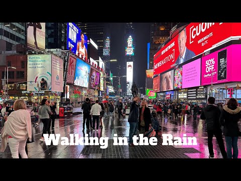 Walking in the Rain at Night through Times Square