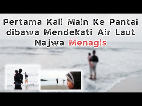 Watching the waves on the beach. Najwa was crying.