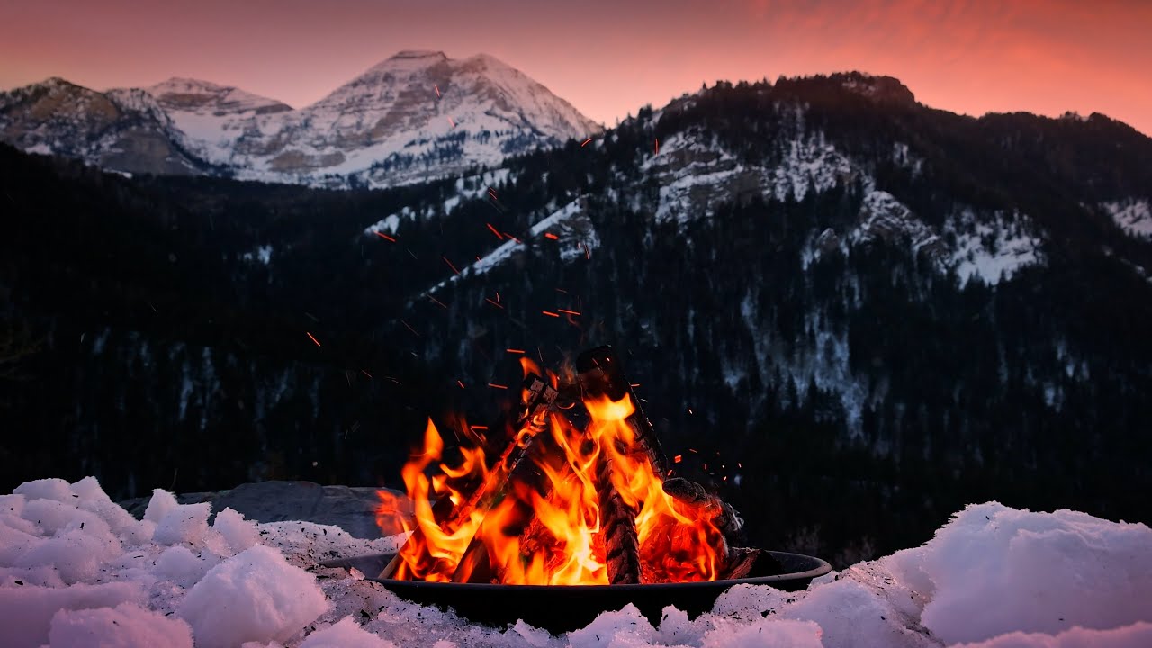 Scenic Winter Sunset Campfire with Snowy Mountain Views and Crackling Sounds