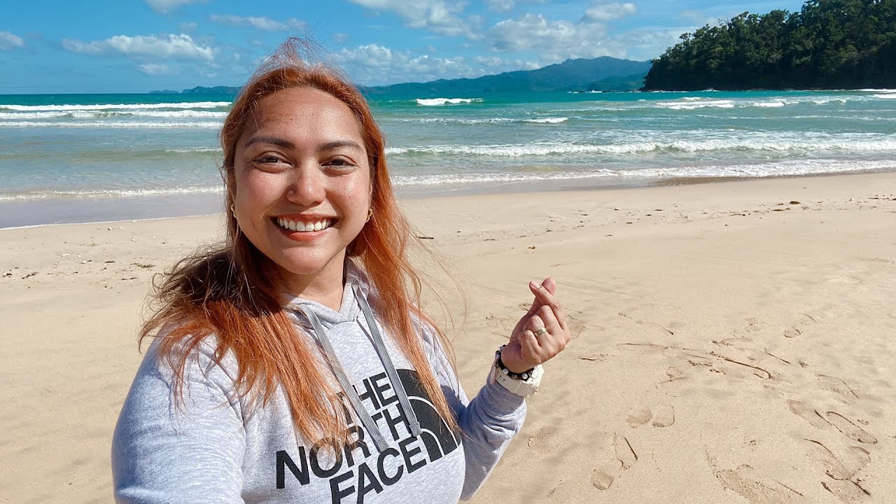 Experience the tranquility at Sabang Beach through the lens of a tourist.