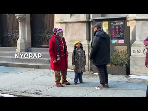 Arnold Schwarzenegger plays Santa Claus as he films  The Man With The Bag in New York City