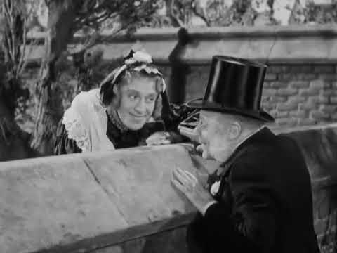 Charley's Aunt (1941) - "Auntie" and Stephen meet at the wall.