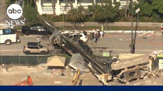 Construction rig crashes onto cars, sparks fire in Miami's Brickell; four hospitalized