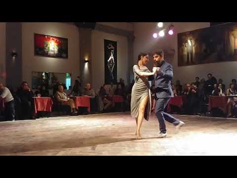  Mariela Soledad Chaves  and  Konstantinos Riginos  are  dancing  to  the  milonga  "  La Punalada  "  by  Juan D'Arienzo  in  2019