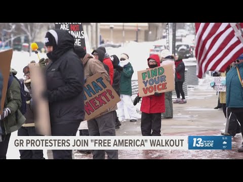 Grand Rapids protestors joined 'Free America Walkout' in opposition of President Trump