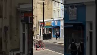 Police Officers Chase Naked Man Sprinting Down Street in London