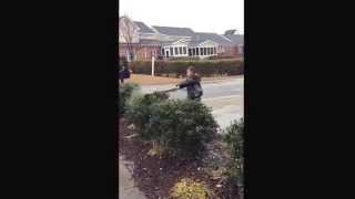 Kai messin around with a bat and bushes