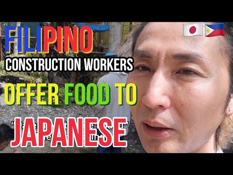 Japanese talking to Filipino construction workers and teach Nihon-go.