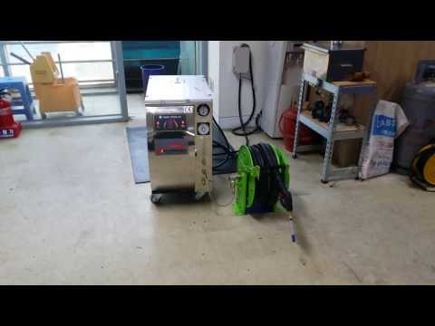 Retractable steam jet hose reel.