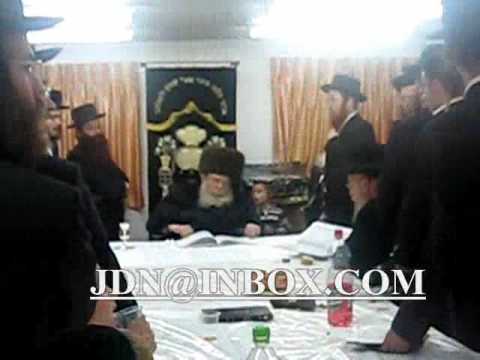 Sadigerer Rebbe affixing Mezuzah on doorpost of new Shul Shvat 5770