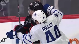 Ridly Grieg takes a slap shot on the open net then Reilly cross checks him in the face