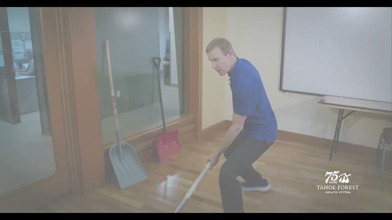 Man with a shovel demonstrating proper shoveling techniques