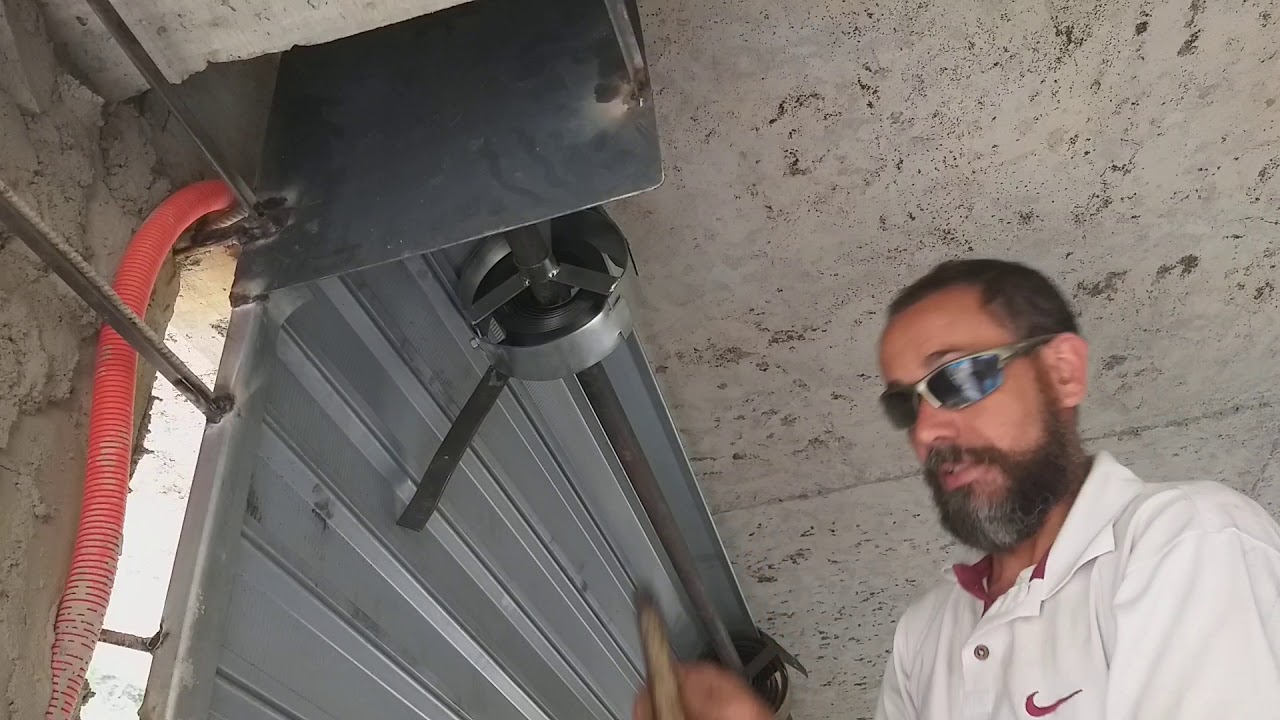 Porta de aço de enrolar, colocação das mola