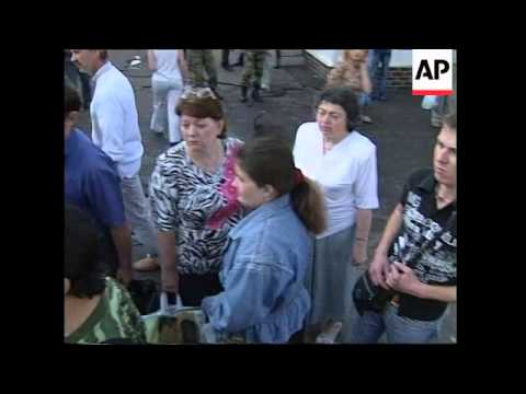 Commuters lay flowers at blast scene, reactions