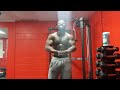black muscle man flexing big back
