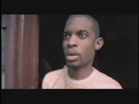 Trailer still: Beans framed against Philly rowhomes as a hard beat drops