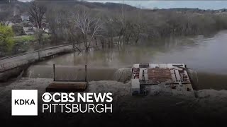 Video shows runaway barge stuck on dam
