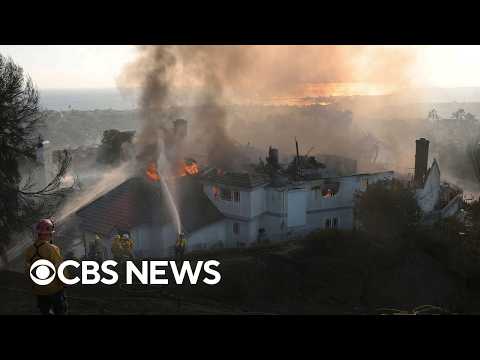 Thousands evacuate as massive California fires engulf homes