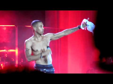 Trey Songz ripping off his shirt and kissing girl on stage