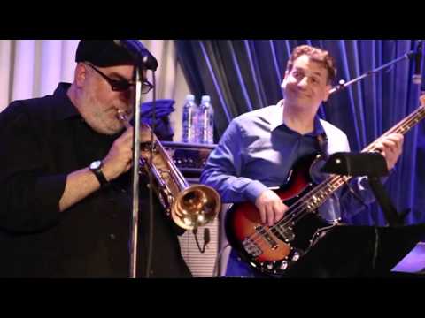 Randy Brecker solos on "Let Me Just Follow Behind"