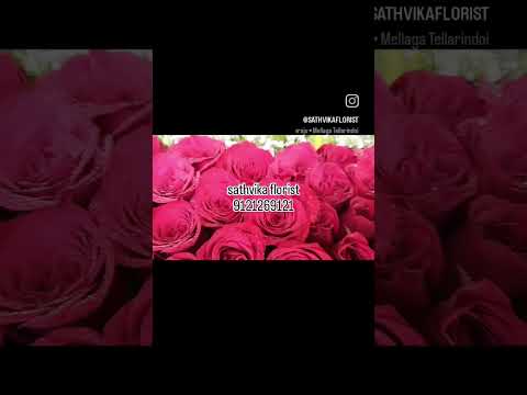 #A beautiful flower arrangement made with roses and round gypsy flower in a wooden basket.