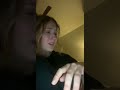 Orange Cat Biting On To Girls Wrist