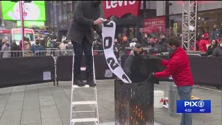 2021 hardships go up in smoke at Times Square Good Riddance Day