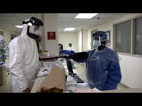 Reporter Gives Desperate Nurse His Protective Mask