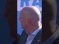 Heckler derails Christopher Luxon's press conference while hanging off a fence | Checkpoint
