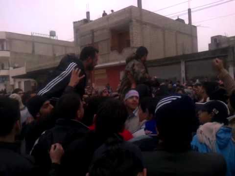 مظاهرة بمشاركة الجيش الحر في حي بابا عمرو في مدينة حمص في أربعاء "الشهداء"