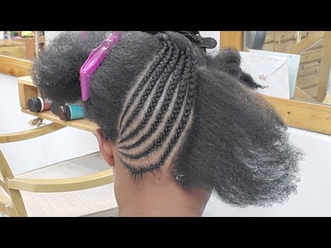 Cornrow braided updo hairstyle on natural hair with...