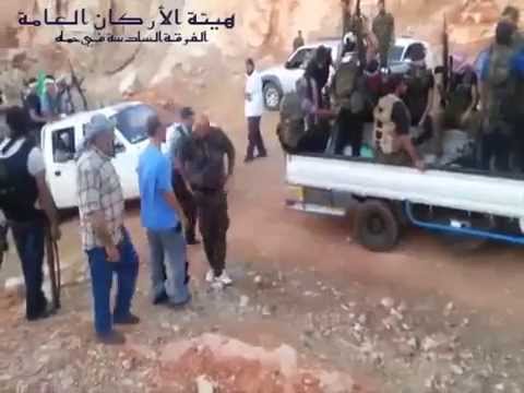 برومو حول تشكيل الفرقة السادسة في حماة وعرض عسكري من قبل مقاتلي الفرقة