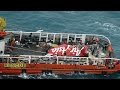 Indonesian search team raises tail of crashed.