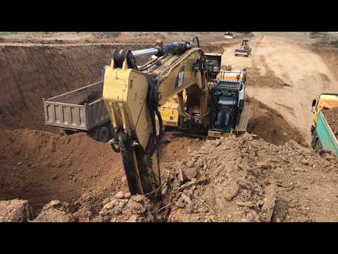 Caterpillar 365C L Excavator Loading Trucks With 3 Passes