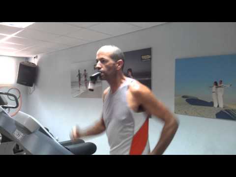 Triathlete Tomer Baskind using POWERbreathe IMT on treadmill