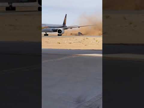 OMG! tractor trailer blown over by airplane jet blast!! jet airways triple seven Boeing 777-300ER.