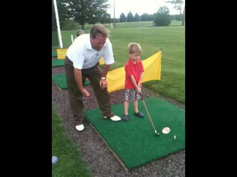 Part of a video titled How To Teach Your Kids How To Play Golf! - YouTube