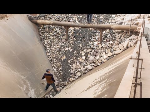 Barges are unloading 4,500 tons of large cobblestone - Smooth, relaxing flow of rocks