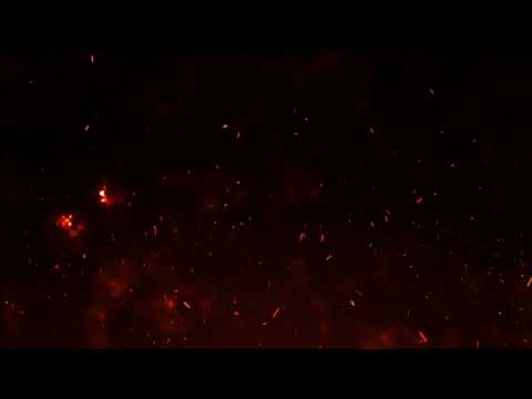 4k fire embers fire Particles sparks over black background, Fire flames particles swirls in the air.