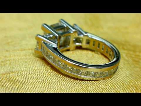 Six carat princess cut diamond, platinum three stone ring