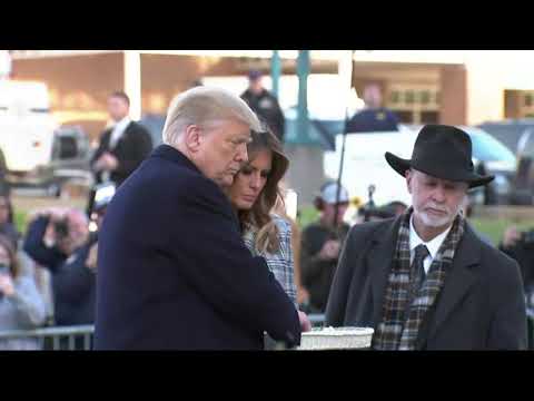 President Donald Trump and First Lady Melania Trump paid tribute to the 11 people killed at a Pittsburgh synagogue by placing rocks and flowers on a makeshift memorial (Oct. 30)