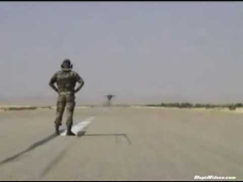 Fearless man facing extra low fighter jet flyby