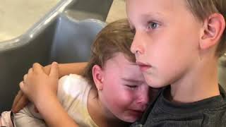 Brother consoles crying sister