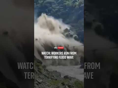 Watch: Workers run from terrifying flood wave