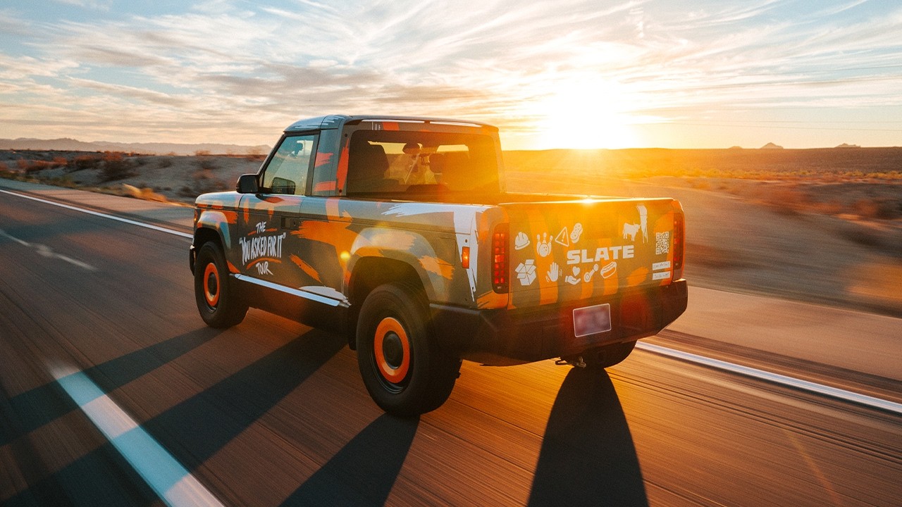 Slate electric pickup truck on a desert road trip