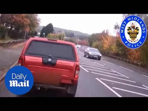 Driver brake checks cyclist and tries to run him off the road
