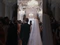 Groom surprises bride with serenade while she walks down the aisle!