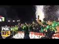 OREGON Ducks players chant no means no with.