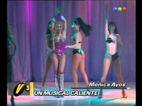 Mónica Ayos, Musical Caliente -- Versus