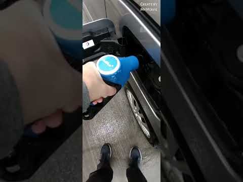 UK courier Filling AD Blue at the service station. Easy Peasy